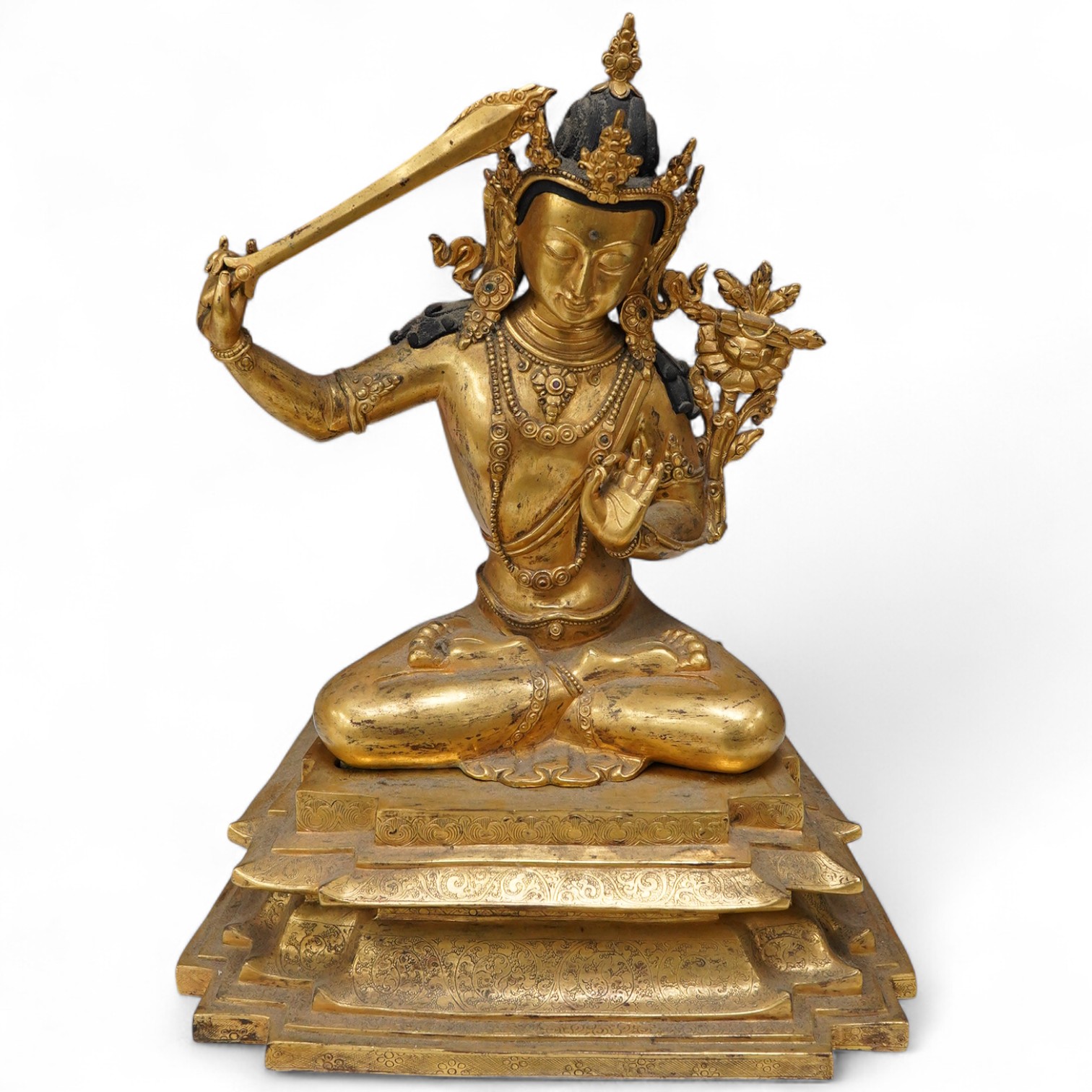 A gilt bronze figure of Manjushri, 31cm